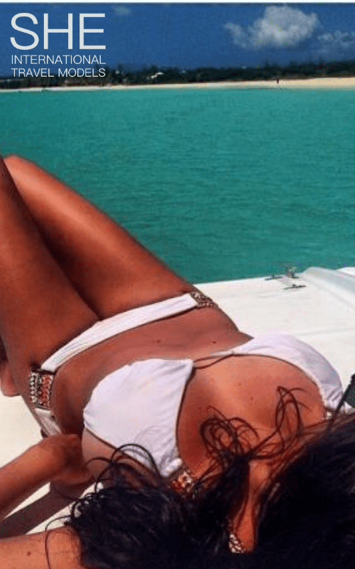 Nina on a boat enjoying the sun
